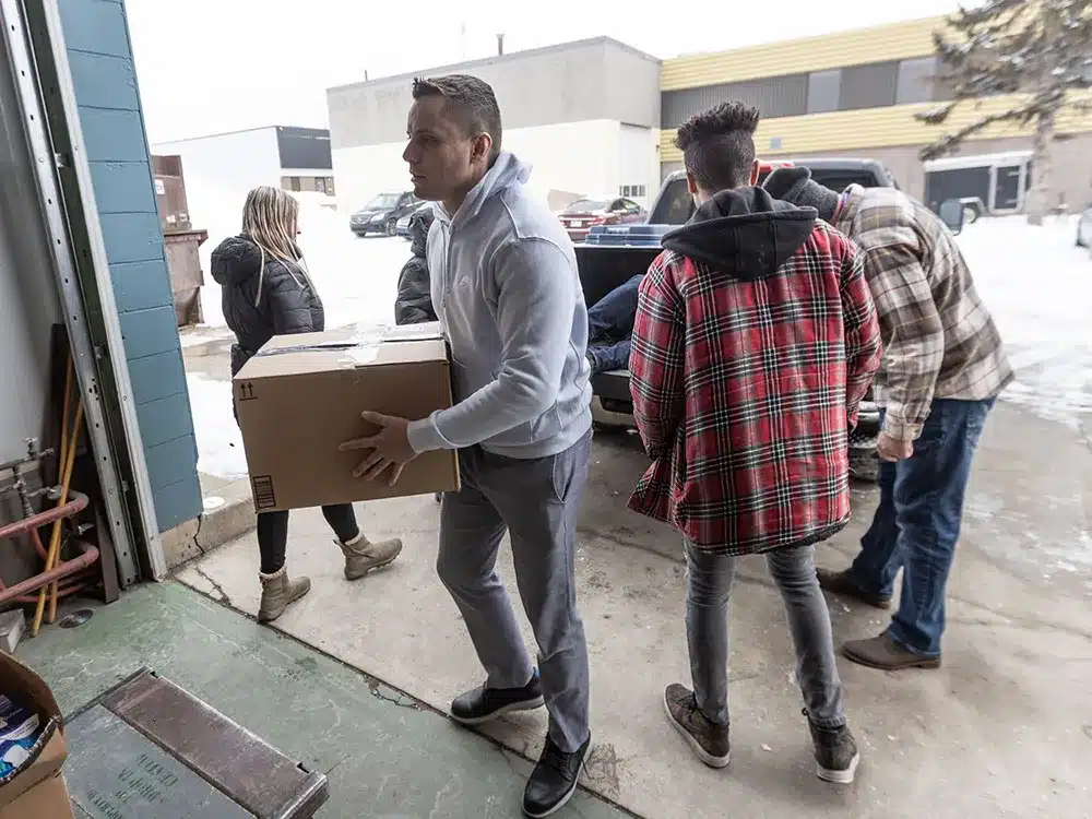 Steve Dimic helping out the Inn from the Cold organization in Calgary